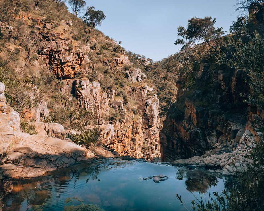 Morialta Conservation Park - water pool at top of first falls with red rock formations